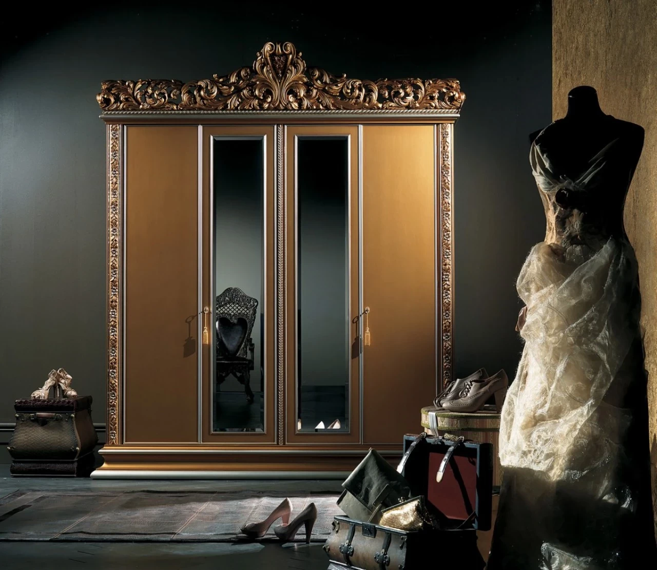 Gold-leaf wardrobe with mirrored doors and a carved crest, luxury Italian furniture in London